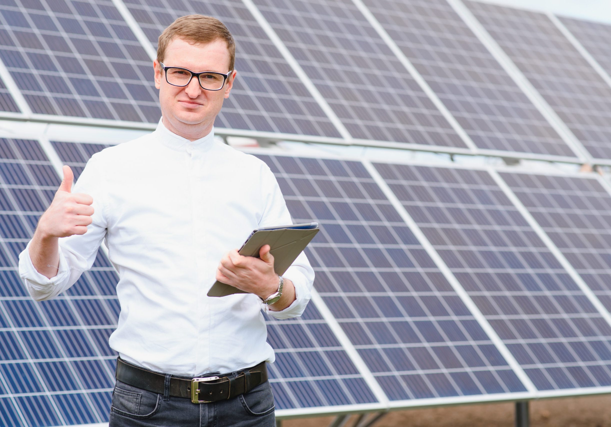 Solar,Energy.,Young,Business,Man,In,A,White,Shirt,Near